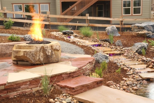 A waterfall and fire pit